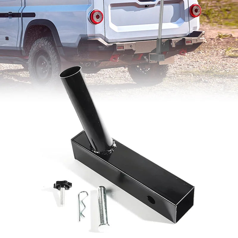 A black universal hitch mount flag pole holder with mounting hardware shown next to a truck.
