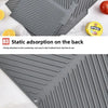 A silicone dish drying mat with a ribbed design is shown being used on a countertop.