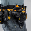 A black tool belt with yellow accents and a black tool is visible on a person's jeans.