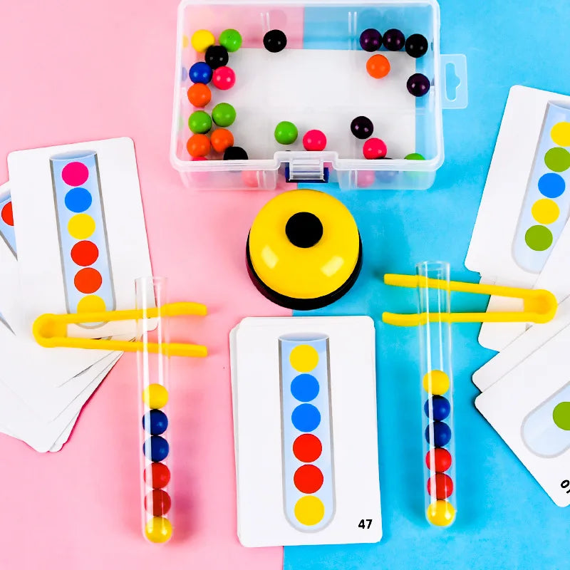 A set of Montessori wooden bead sorting game components including a clear plastic box, yellow bead, and test tubes with color