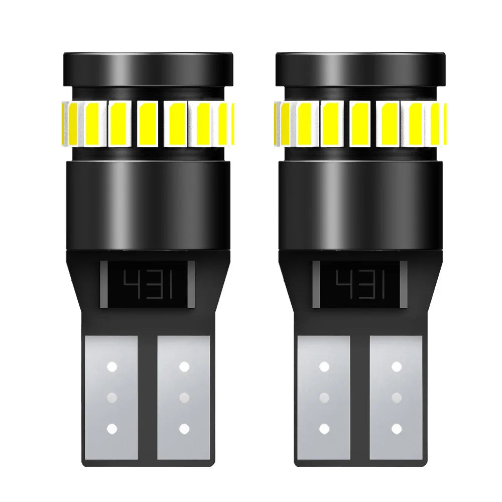 A pair of black LED bulbs with yellow accents and a connector, used for replacement.