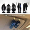 A set of black garage door remote visor clip holders displayed next to an installed unit in a car ceiling.