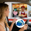 A woman in a car holds a pink star-shaped contactless payment wand towards a man inside a storefront window.