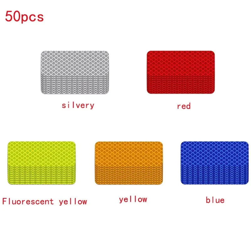 Five square reflective strip stickers in silvery, red, fluorescent yellow, yellow, and blue colors.