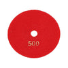 A red circular polishing pad with the number 500 printed on it.