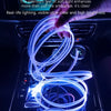 A hand is holding a flexible blue LED light strip that illuminates the interior of a car dashboard.