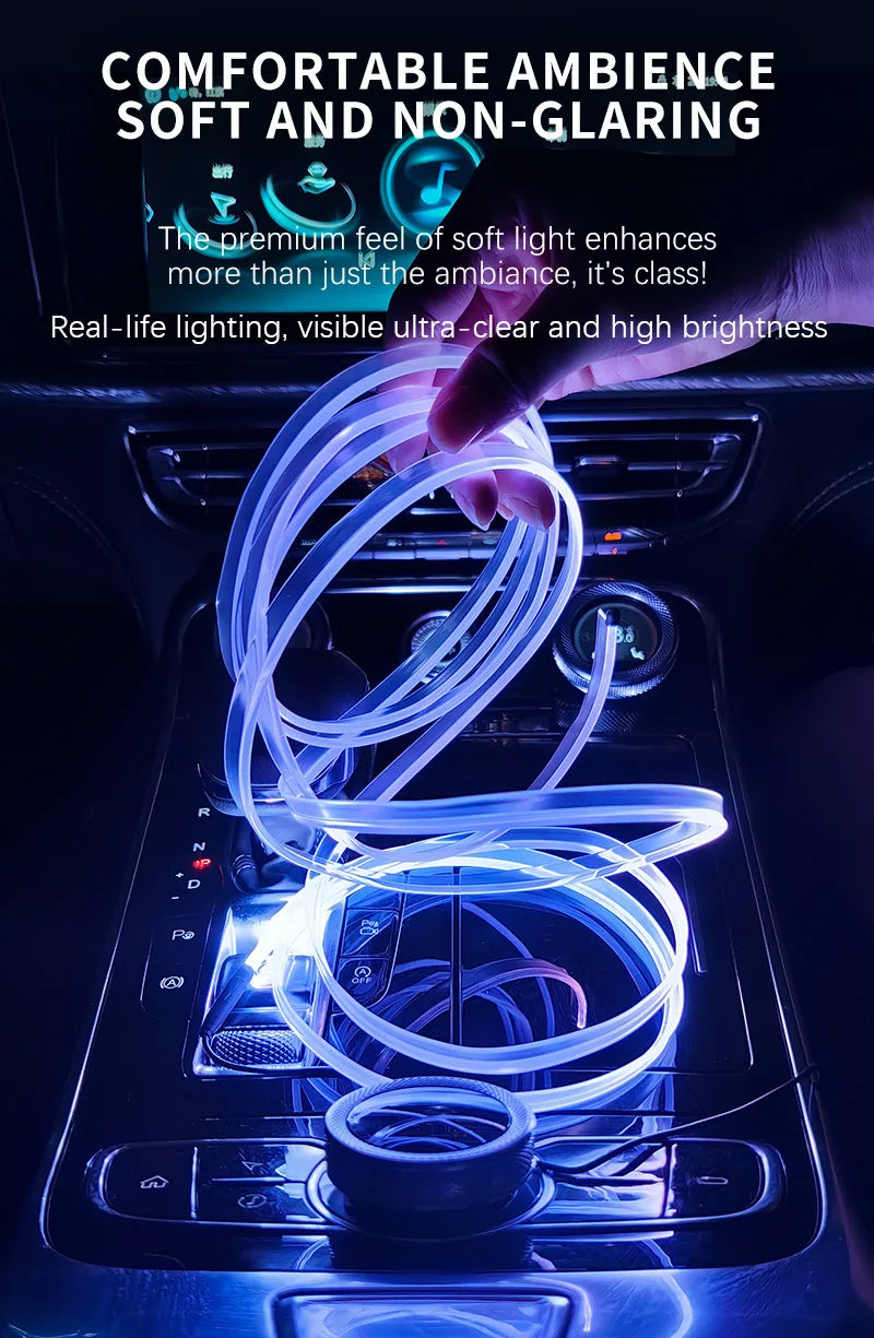A hand is holding a flexible blue LED light strip that illuminates the interior of a car dashboard.