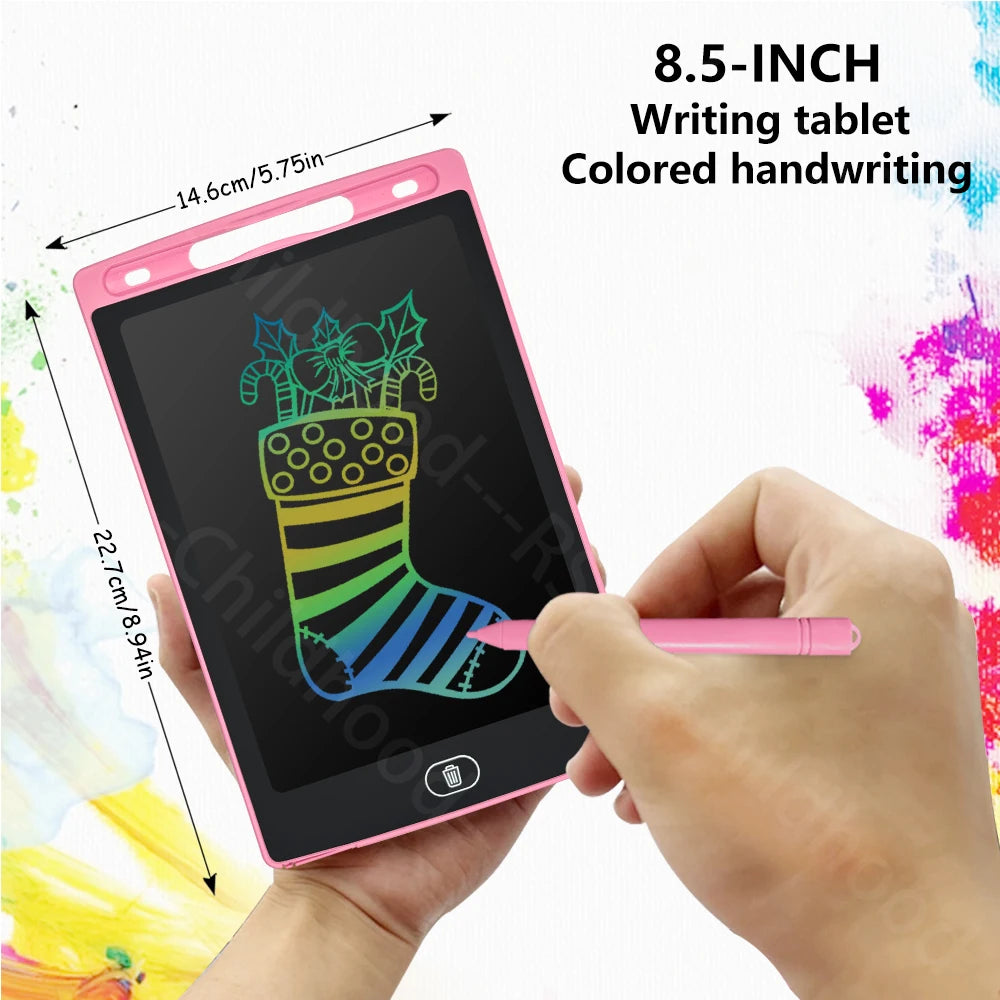 A hand holds a pink 8.5-inch LCD writing tablet with a stylus, demonstrating colored handwriting on the screen.
