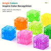 A collection of brightly colored, transparent magnetic building blocks in various shades including green, orange, yellow, blu