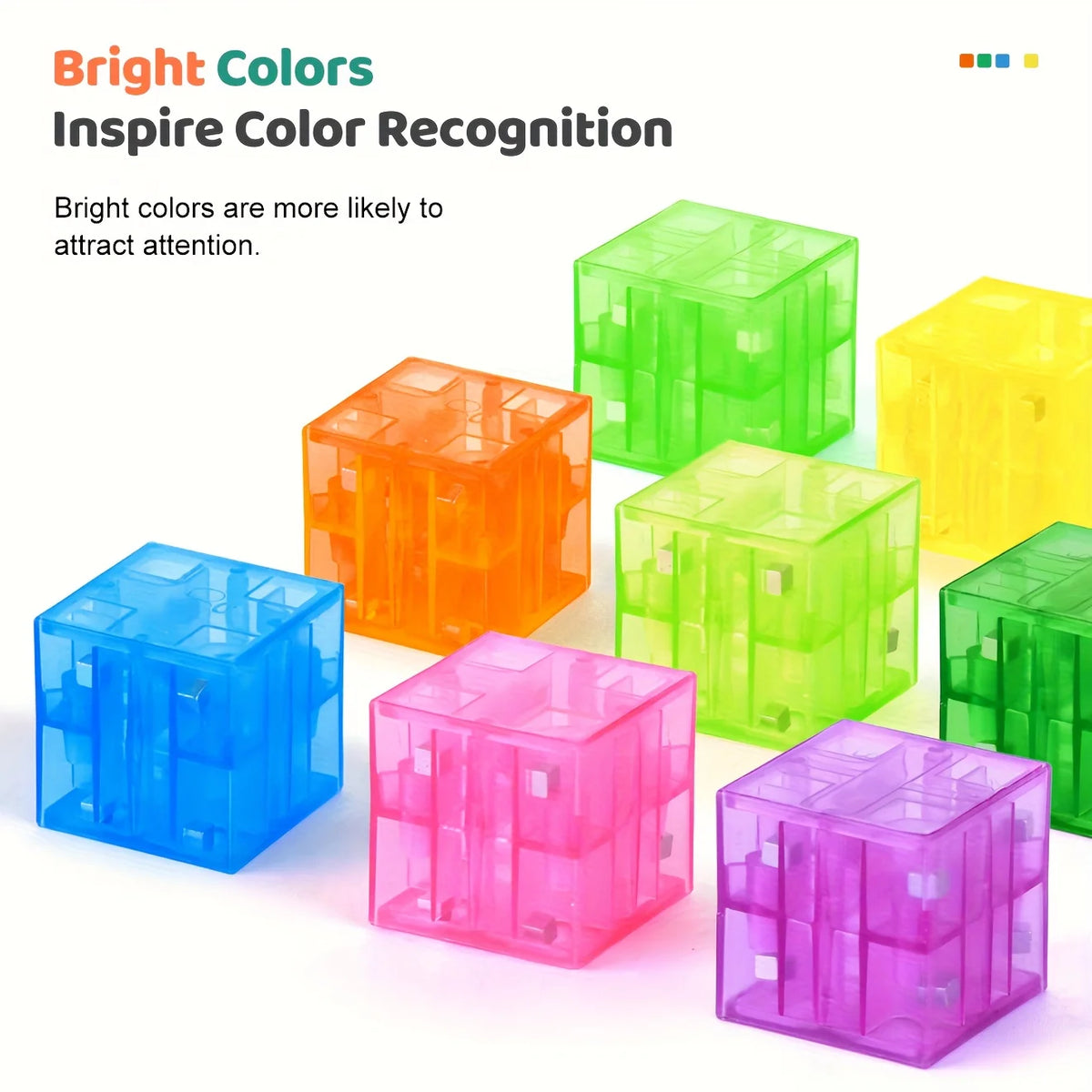 A collection of brightly colored, transparent magnetic building blocks in various shades including green, orange, yellow, blu