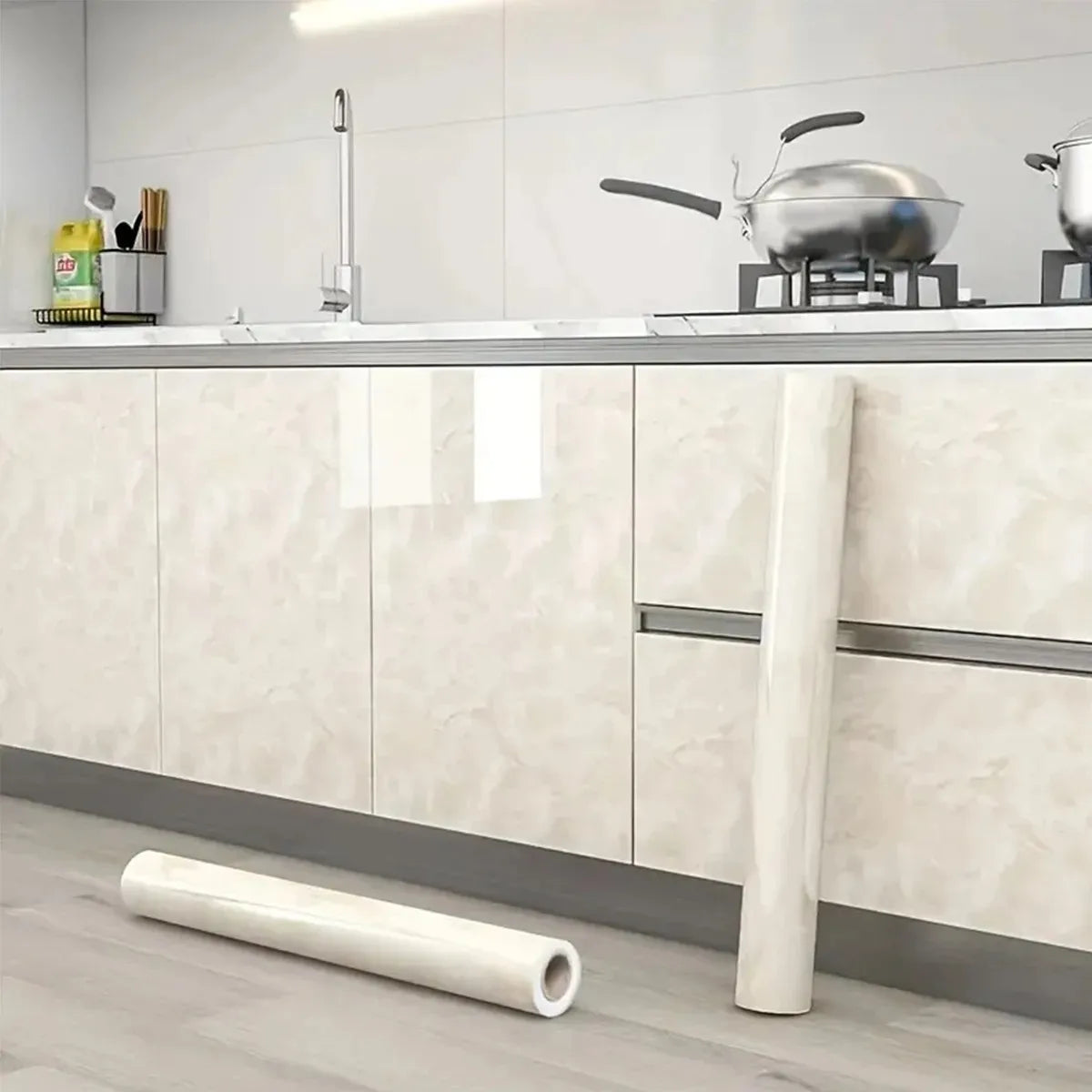 Pearlescent pink marble peel and stick wallpaper applied to kitchen cabinets