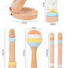 A set of wooden percussion instruments including a mallet, a maraca, and a rattle.