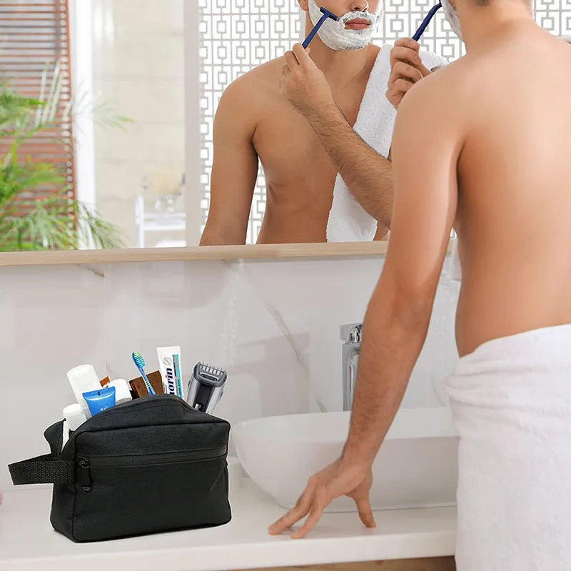 A person is using a large-capacity waterproof travel toiletry bag in a bathroom setting.