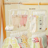 A multi-clip space-saving laundry drying rack displaying various baby clothes hanging to dry in the air.