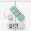 A light green child safety cabinet lock mechanism shown with an inset detail and a separate drawer lock.