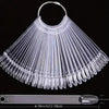 Clear acrylic false nail tips kit with a fan-like design displayed on a ruler.
