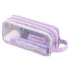 A clear mesh purple pencil case containing pens and other school or office supplies.