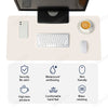 A premium PU leather desk mat featuring a wireless mouse, keyboard, and a cup, highlighting security, waterproof features, an