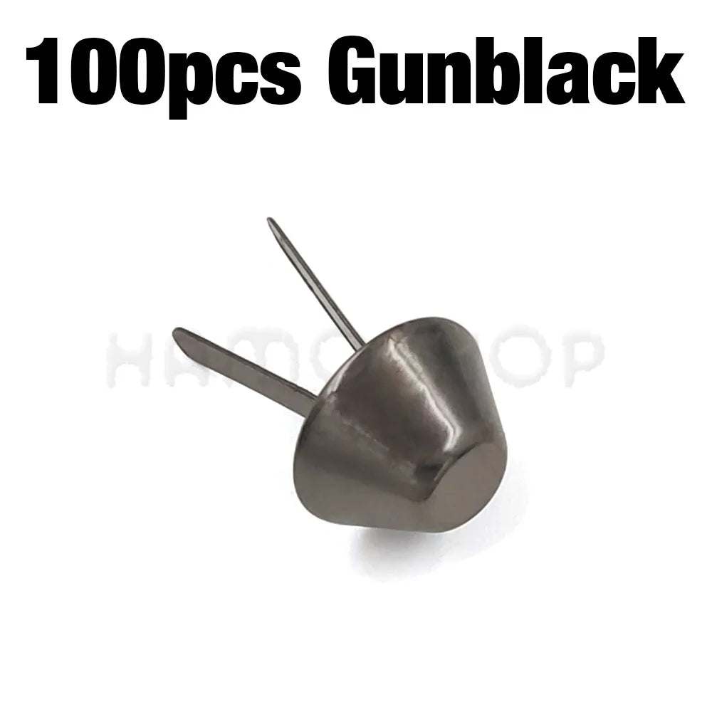 A close-up view of a metal gunblack bag bottom feet stud with a pointed pin.
