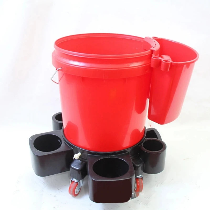 A red universal bucket organizer caddy for car detailing tools with a large bucket and smaller containers.