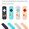 A set of silicone baby teether toys shaped like remote controls in black, blue, beige, and pink.