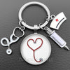 Silver nurse keychain featuring a heart-shaped stethoscope charm and a medical symbol tag