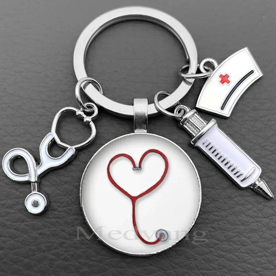 Silver nurse keychain featuring a heart-shaped stethoscope charm and a medical symbol tag