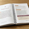 An open notebook showing a page titled The Book of Ezekiel with study questions and text.