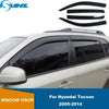 Black window visors for a Hyundai Tucson 2005-2014 vehicle.