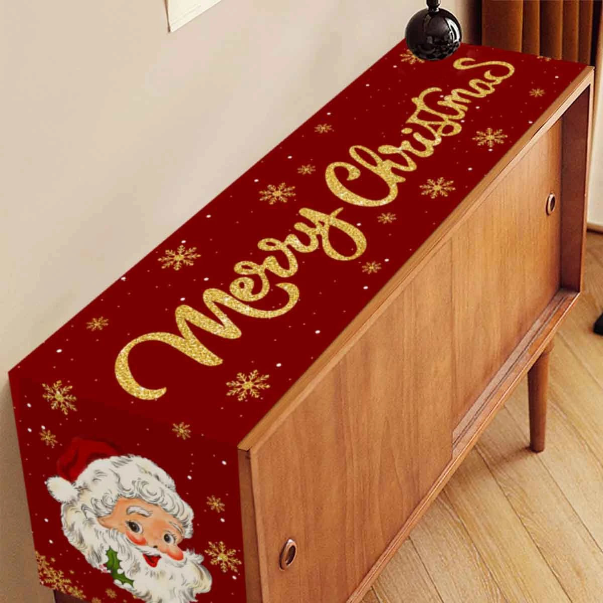 Festive Santa Claus Christmas table runner with gold lettering and a white beard design