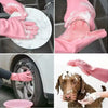 Pink rubber dishwashing gloves are shown cleaning a sink and washing a dog's face.