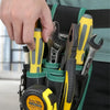 A hand is shown placing various tools like pliers and a screwdriver into a green multi-purpose pouch on a belt.