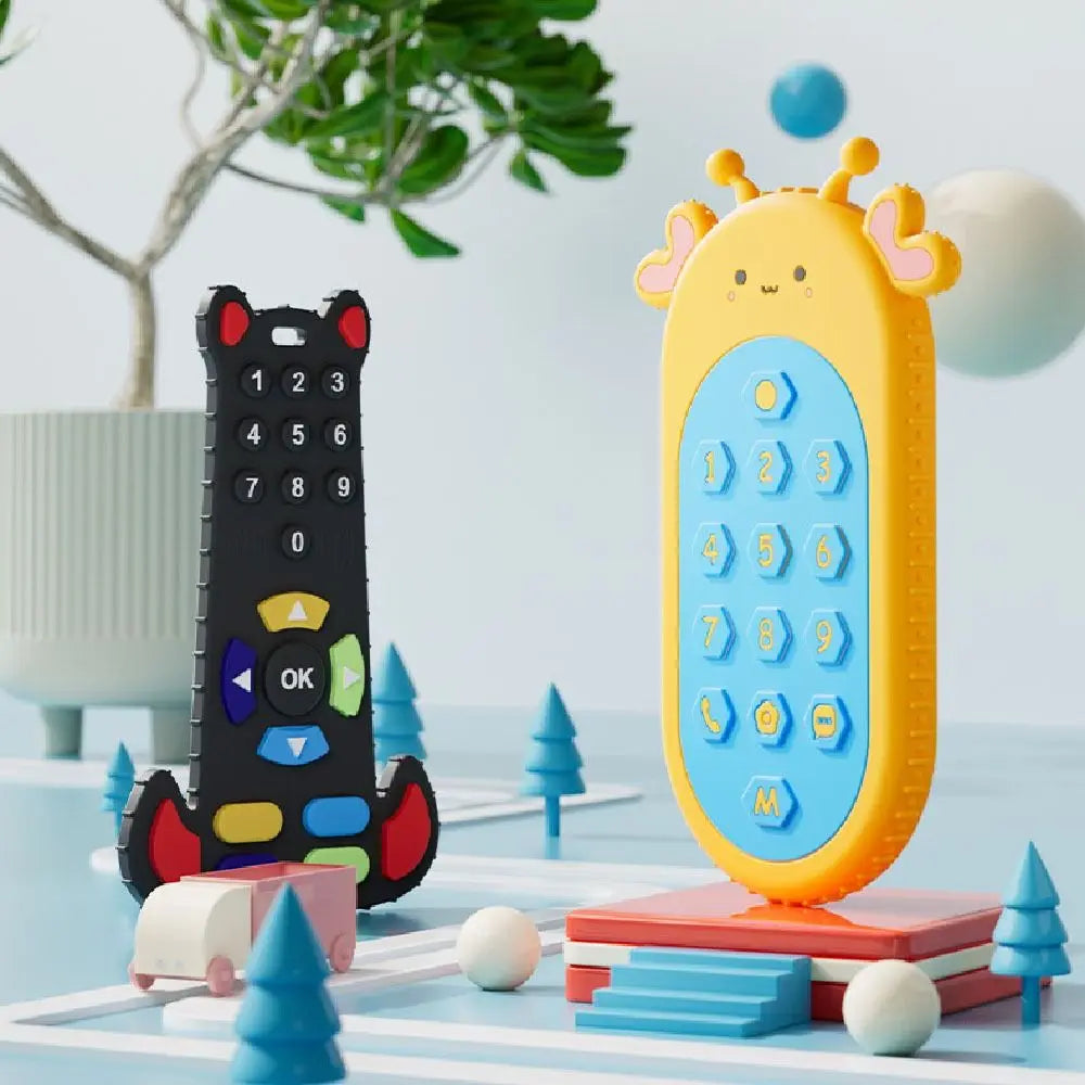 A yellow silicone teether toy shaped like a remote control, surrounded by various wooden and silicone toys.