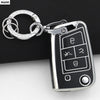 A silver key ring attached to a black car key cover for VW, SEAT & Skoda models.