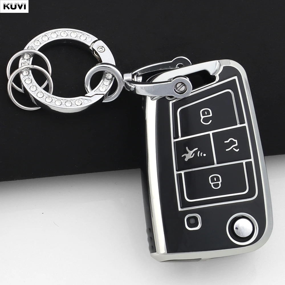 A silver key ring attached to a black car key cover for VW, SEAT & Skoda models.