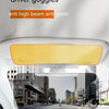 A close-up view of a car's interior showing an anti high beam anti glare driver goggles sun visor extender.