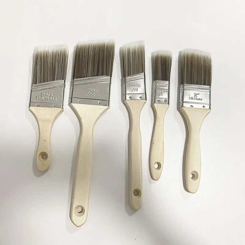 A set of five natural-bristle paint brushes with light wooden handles and silver metal ferrules.