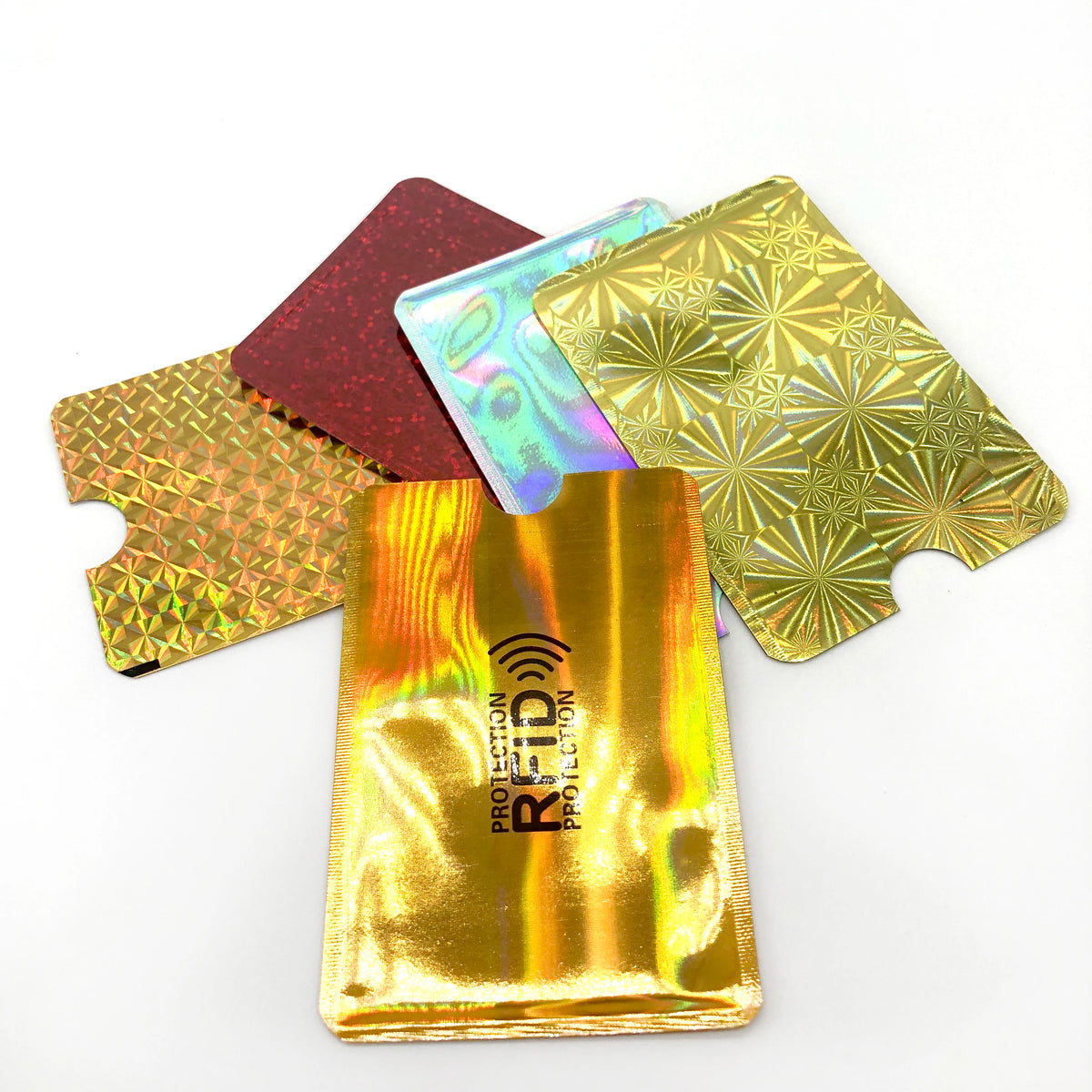 A stack of five RFID-blocking aluminum card holders in various colors and finishes.