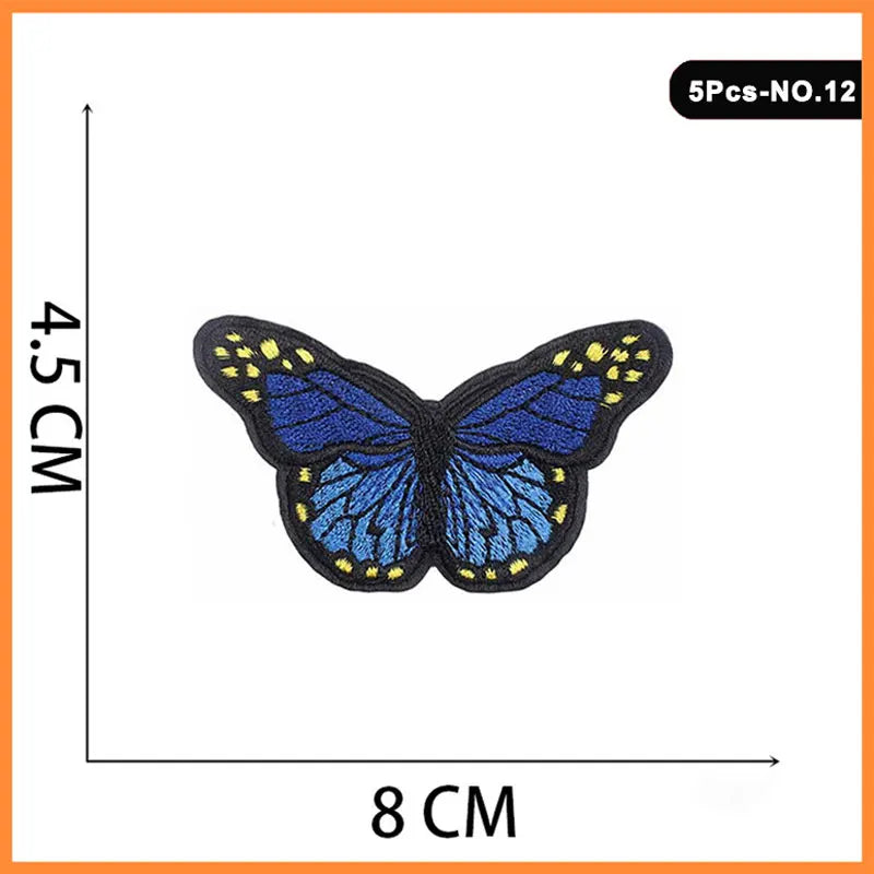 Five embroidered butterfly iron-on patches with blue wings and yellow accents.