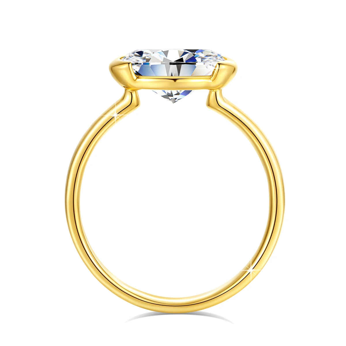 A close-up view of a 14K gold oval moissanite ring with a brilliant clear stone.