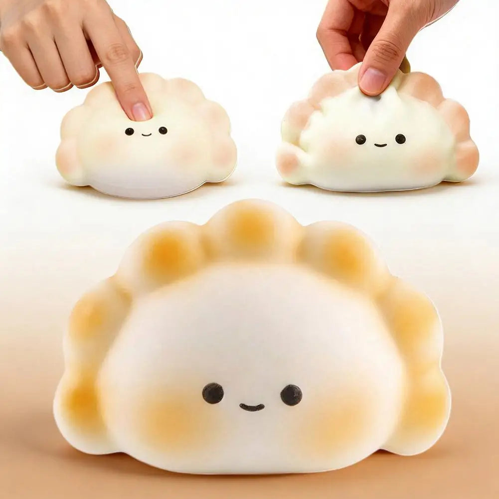 A squishy stress relief toy shaped like a cute, round dumpling with a smiling face.