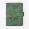 A dark olive green leather passport holder with a world map design.