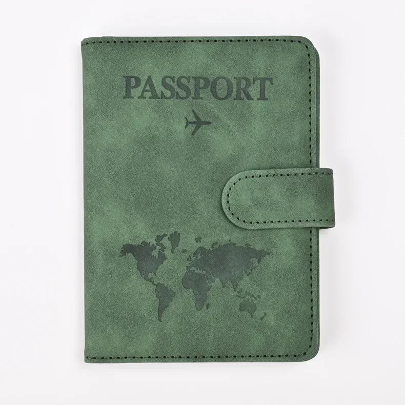 A dark olive green leather passport holder with a world map design.