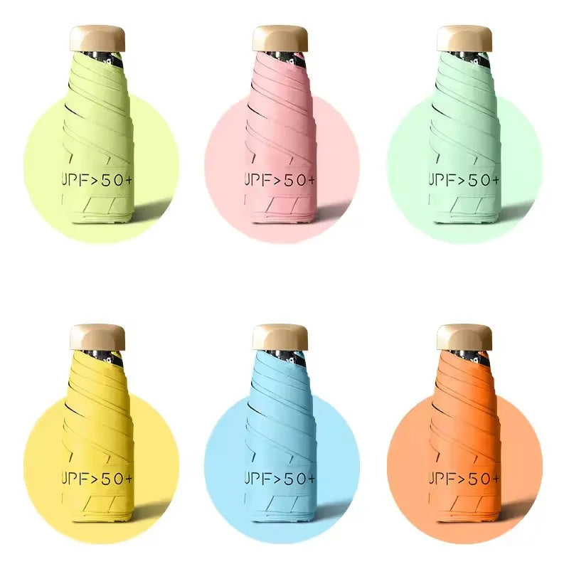Various colored pocket-size folding umbrellas with UV protection displayed in circular backgrounds.