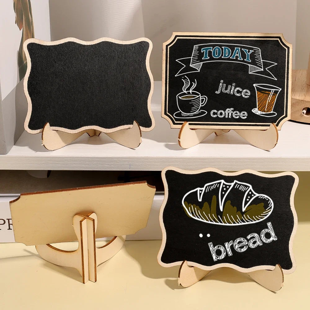 Three mini wooden chalkboard signs featuring illustrations of juice, coffee, and bread.