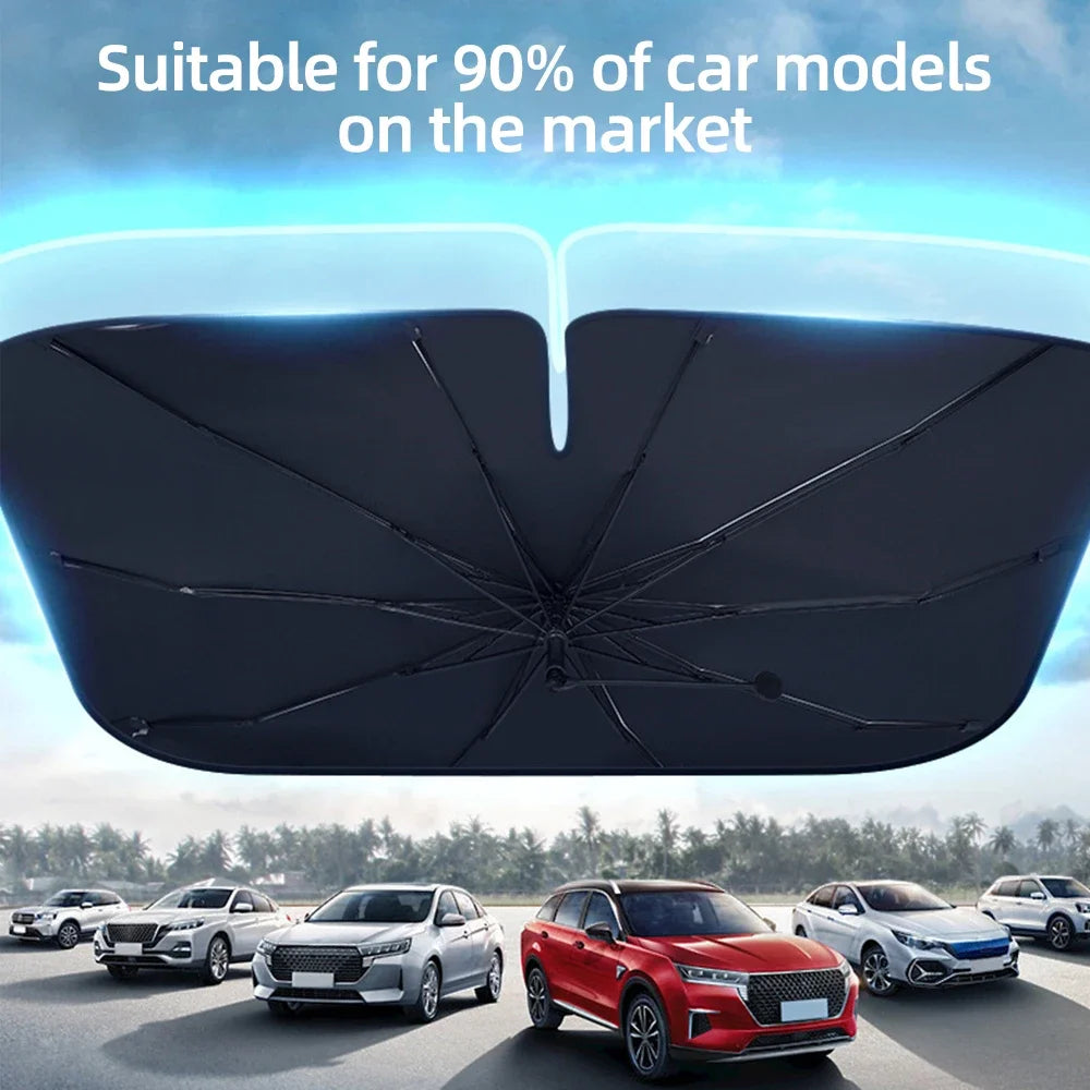 A black foldable car windshield sun shade umbrella is shown above several cars on a road.