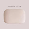 A rectangular, light beige memory foam travel neck pillow with a soft polyester cover.