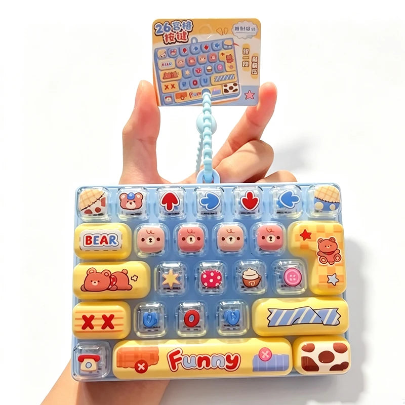 A colorful set of cartoon keycap fidget items and a related instruction card are held by a hand.