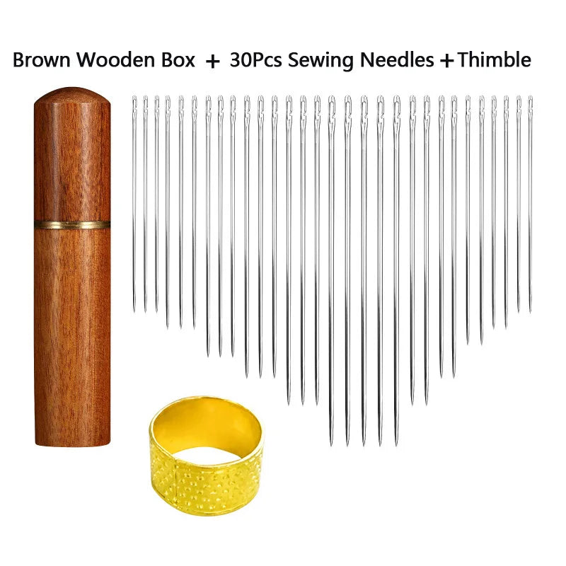 Brown wooden box containing a set of 30 sewing needles and a thimble