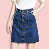 A woman models a dark blue denim mini skirt with visible button details.